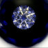 Close-up of a blue gemstone with a dark background